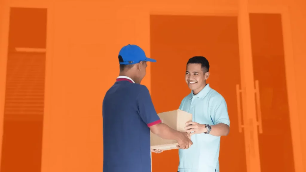 A postal worker in a blue uniform delivering to a stylized house, where a man in a blue polo receives a boxed package. 