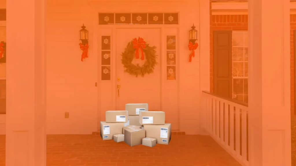 A stack of boxes neatly arranged on a home's porch.