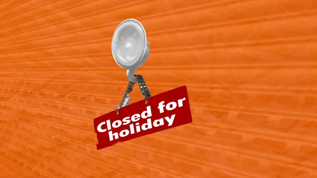 Closed for holiday sign hanging on a door